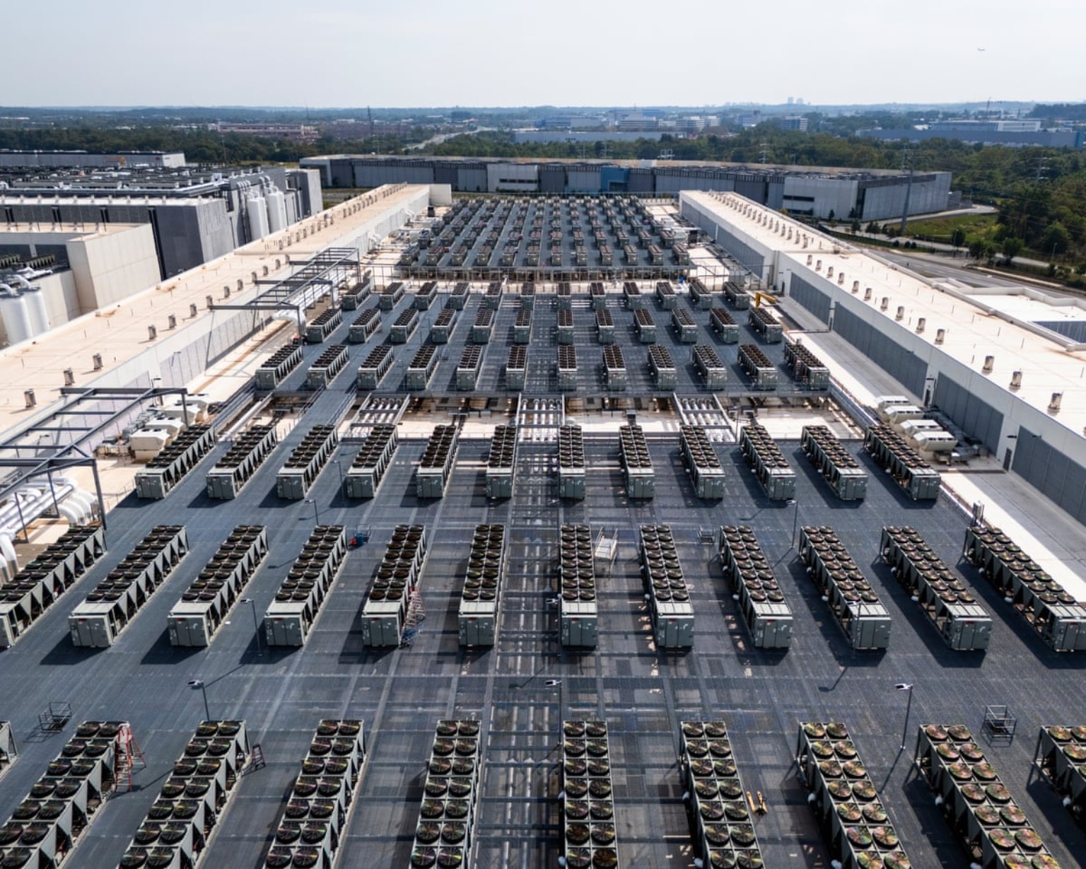 Rows of cooling equipment on a large data center campus